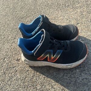 New Balance Kids' Black Sneakers with Blue and Orange Accents